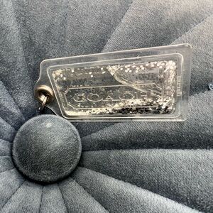 Coach glitter tag in clear and silver sparkle